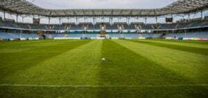soccerball on wide green grass field